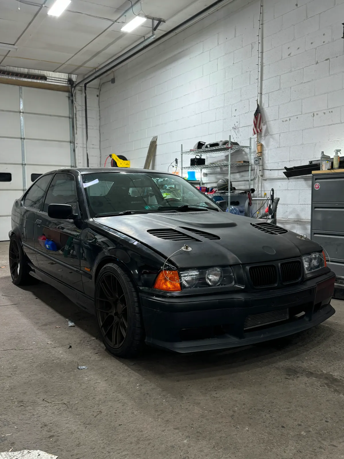Black BMW receiving service inside the shop
