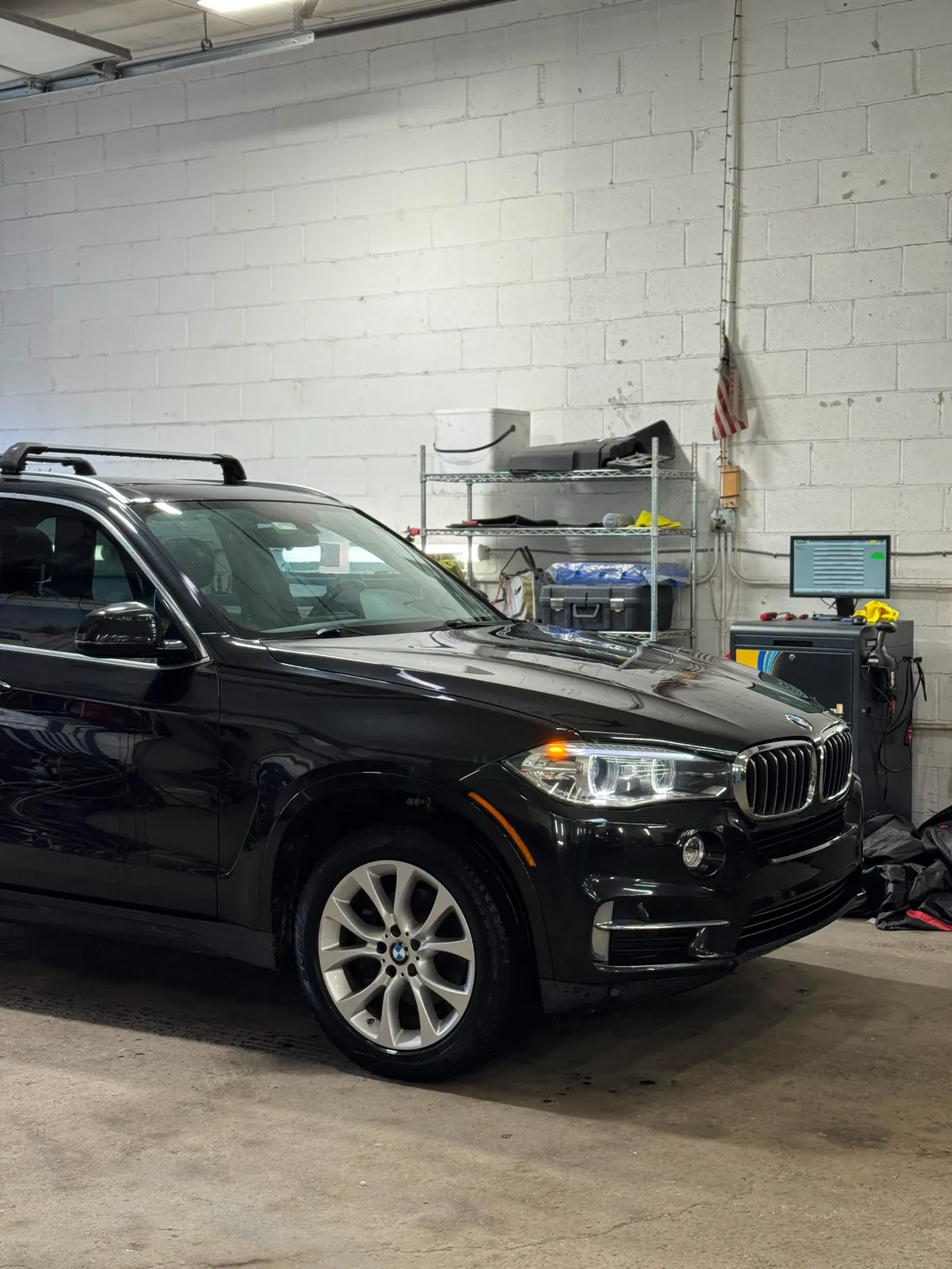 Black SUV inside the Hatboro auto repair facility