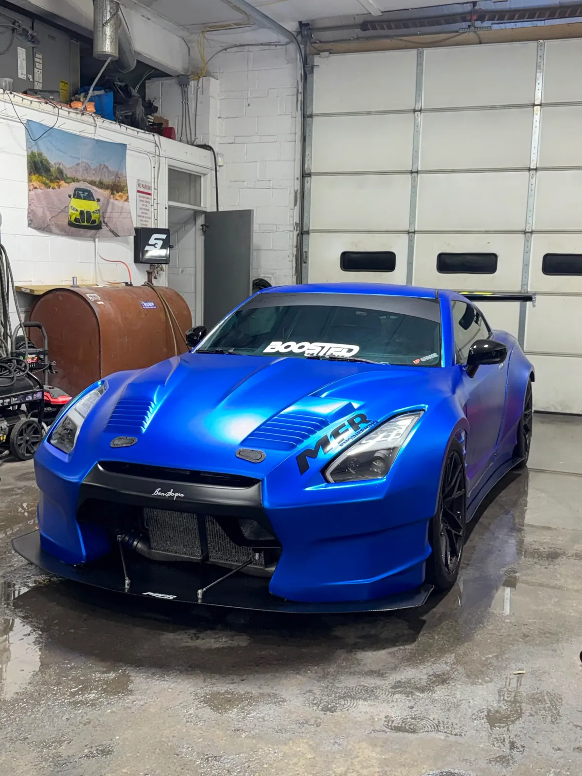 Blue performance car inside Igor’s Auto Repair shop