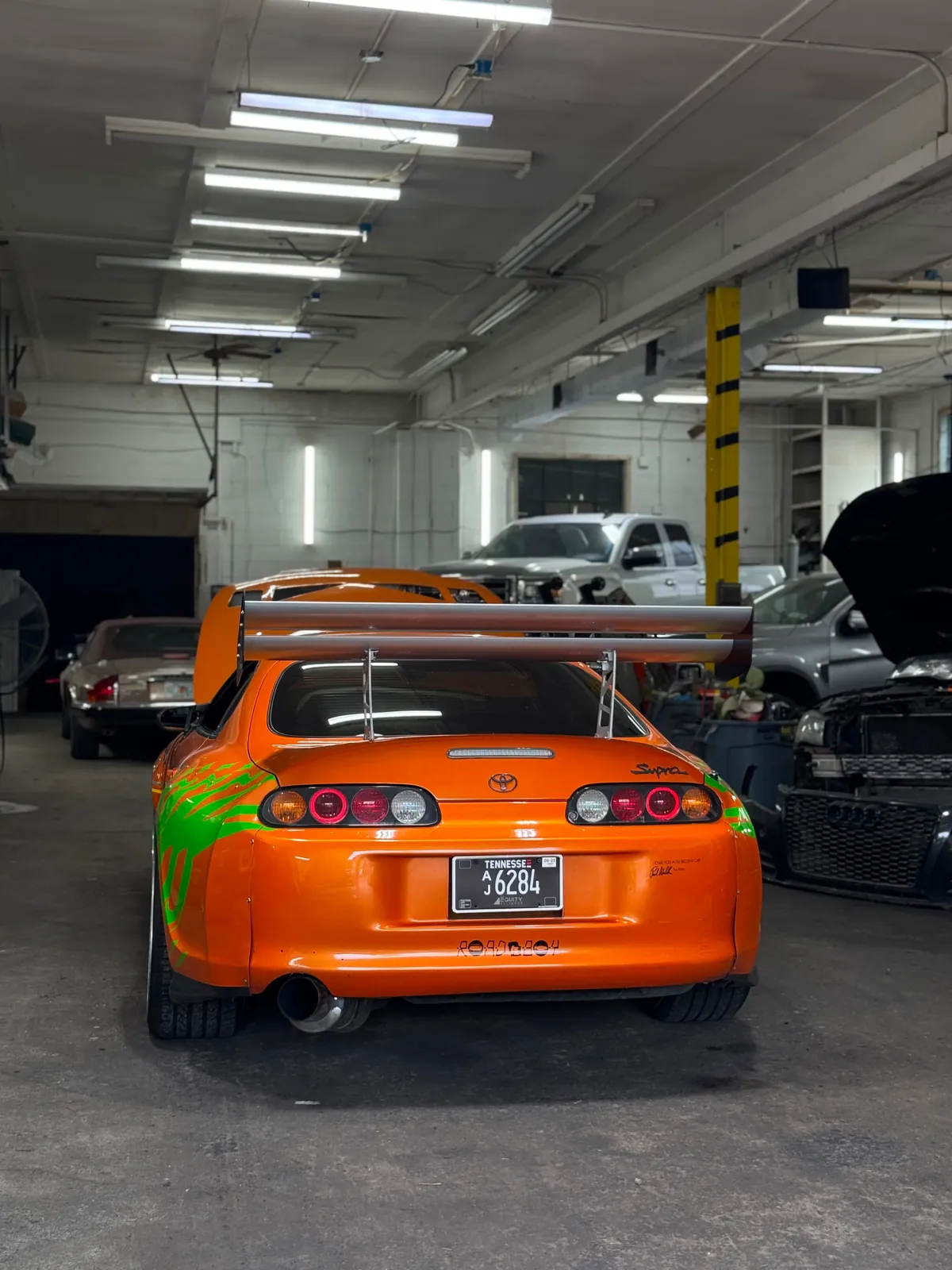 Orange sports car in the Hatboro workshop