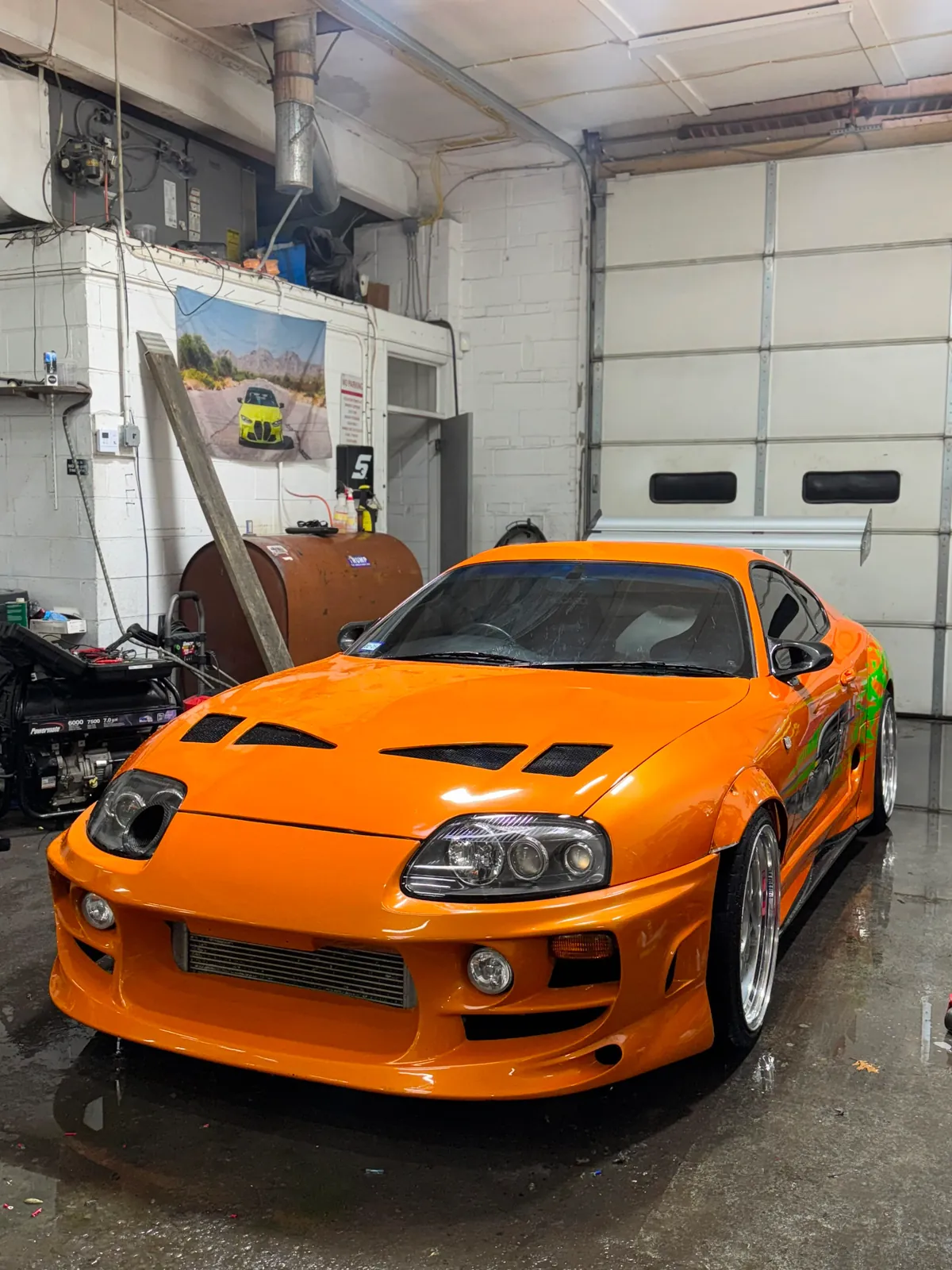 Orange performance car inside Igor’s shop