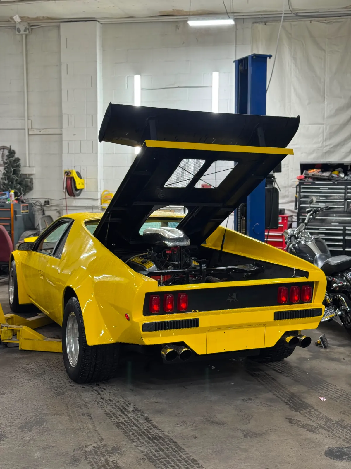 Classic vehicle being worked on inside the auto shop