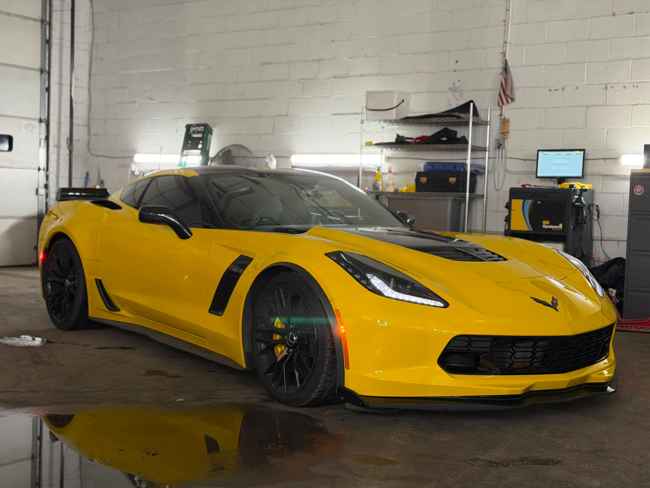 Yellow sports car inside Igor’s automotive shop